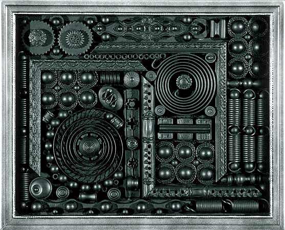 Small assemblage in black. Small assemblage relief scrulpure.